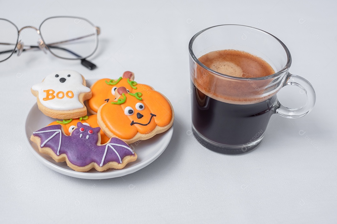 Hot espresso or chocolate cup with funny Halloween cookies. Happy Halloween Day, Trick or Threat, Hello October, Fall Autumn, Traditional, Party and Holiday Concept