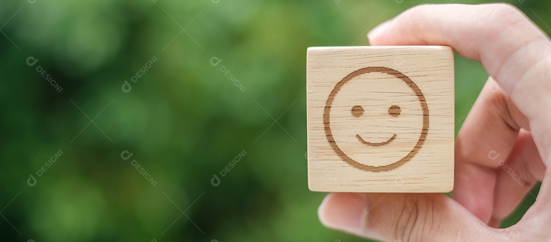 Smile emotion face symbol on wooden blocks. Service rating, rating