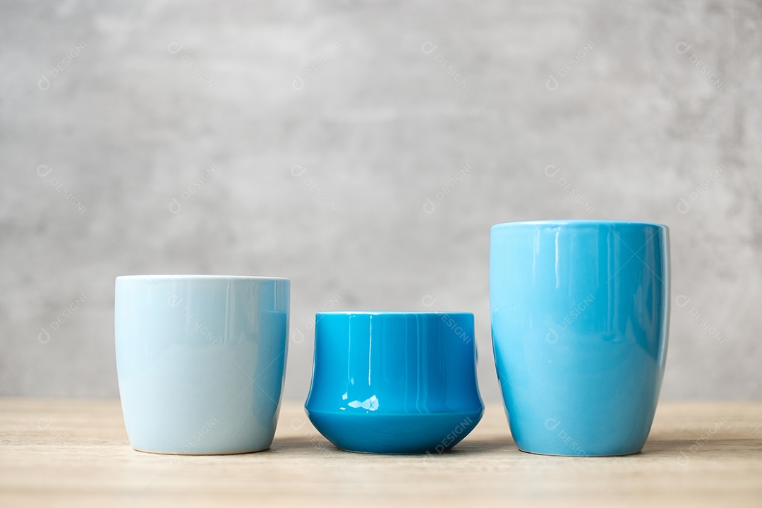 Blue coffee cup and tea mug on wooden table background in the morning.