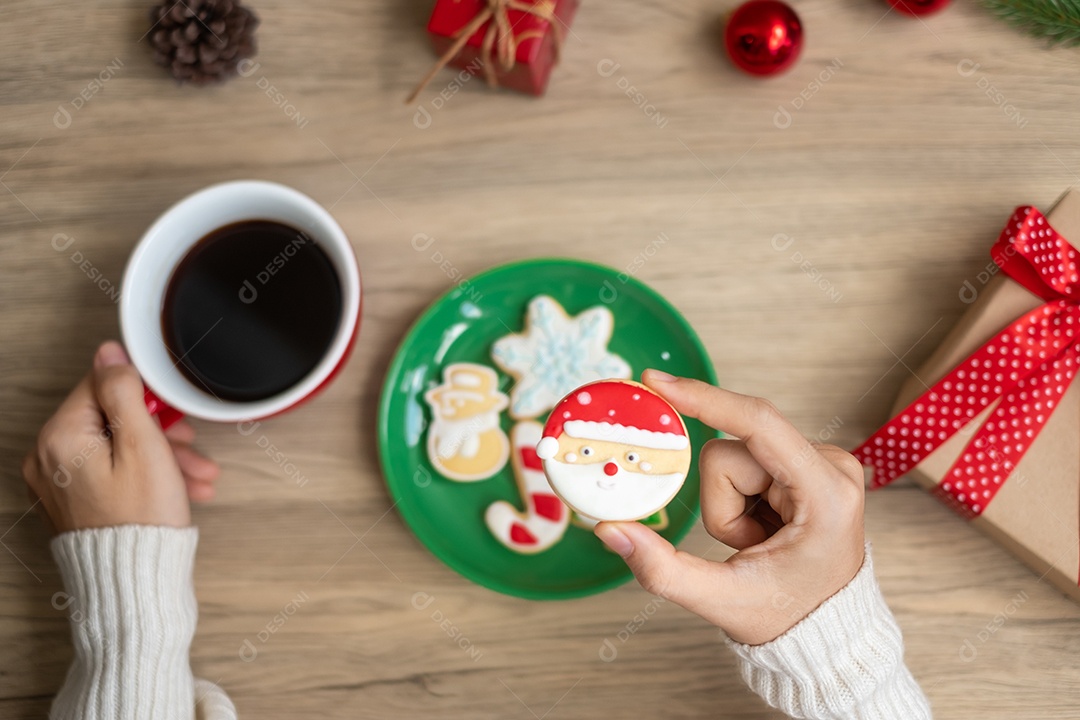 Merry Christmas woman hand holding coffee cup and homemade.