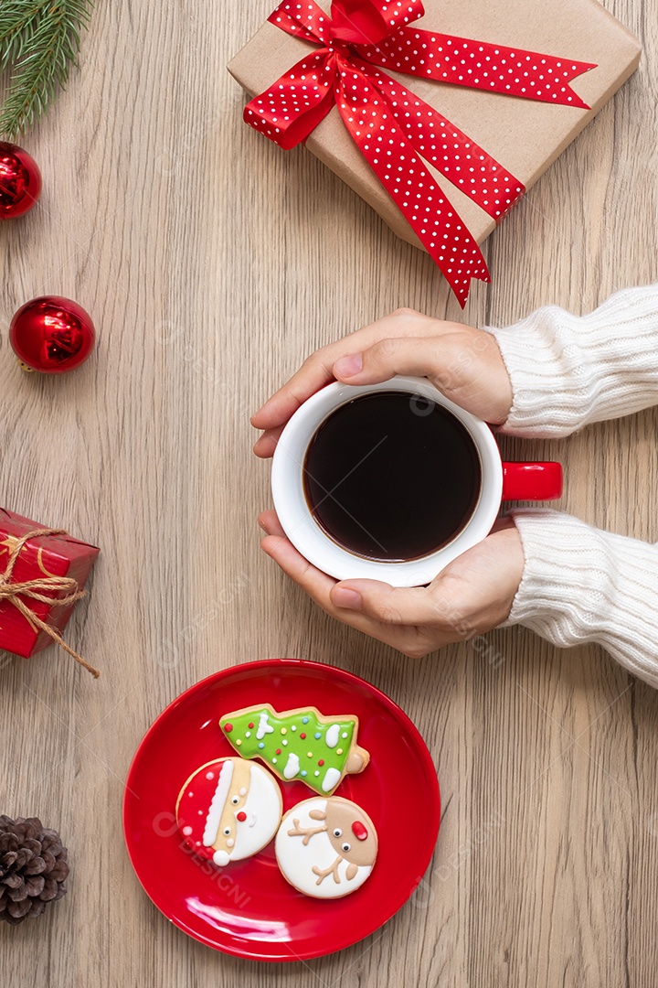 Merry Christmas woman hand holding coffee cup and homemade.