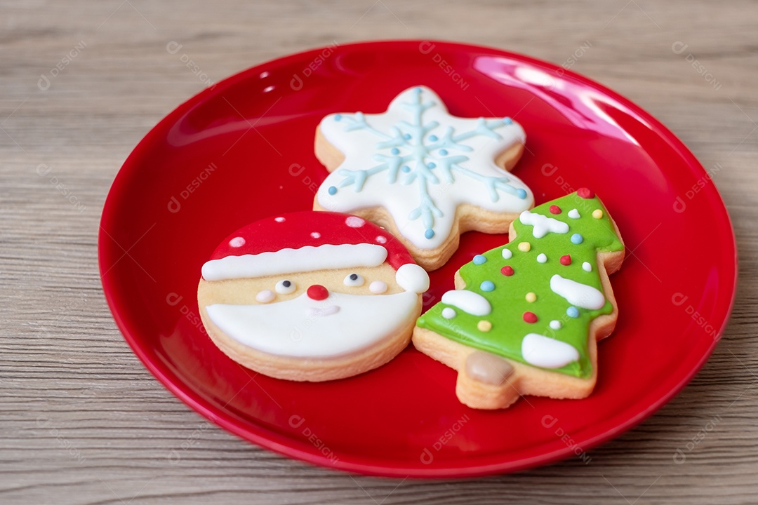 Merry Christmas with homemade cookies on wooden table background.