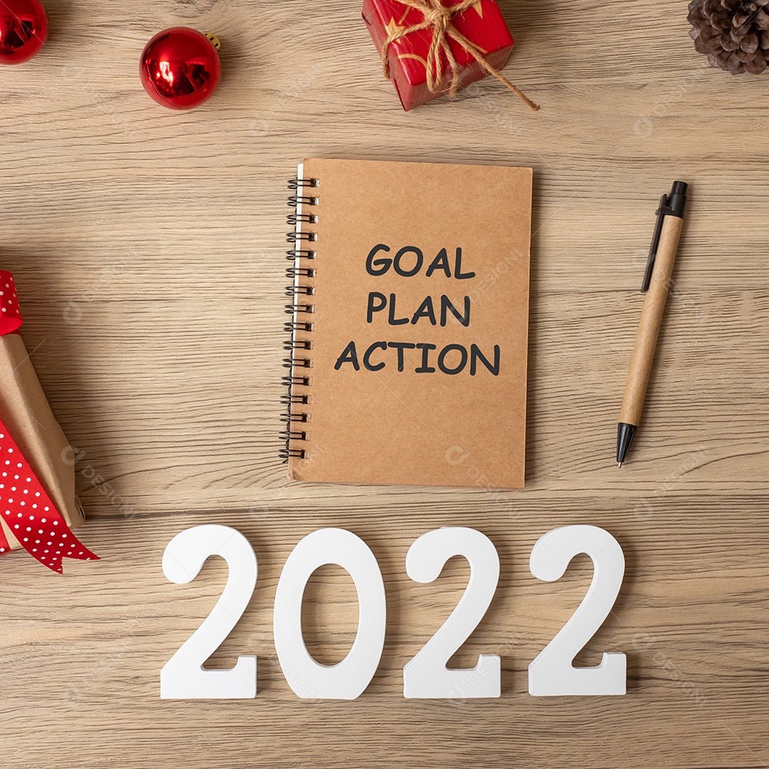 Ação do plano de metas para 2022 com notebook, presente de Natal e caneta.