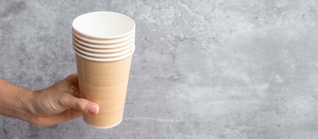 Eco-friendly food packaging or takeaway coffee cup. Hand holding.