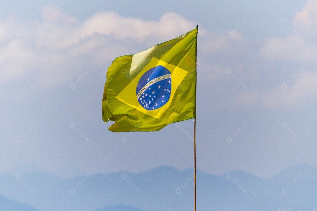 flag of brazil outdoors on a beach in rio de janeiro in brazil.