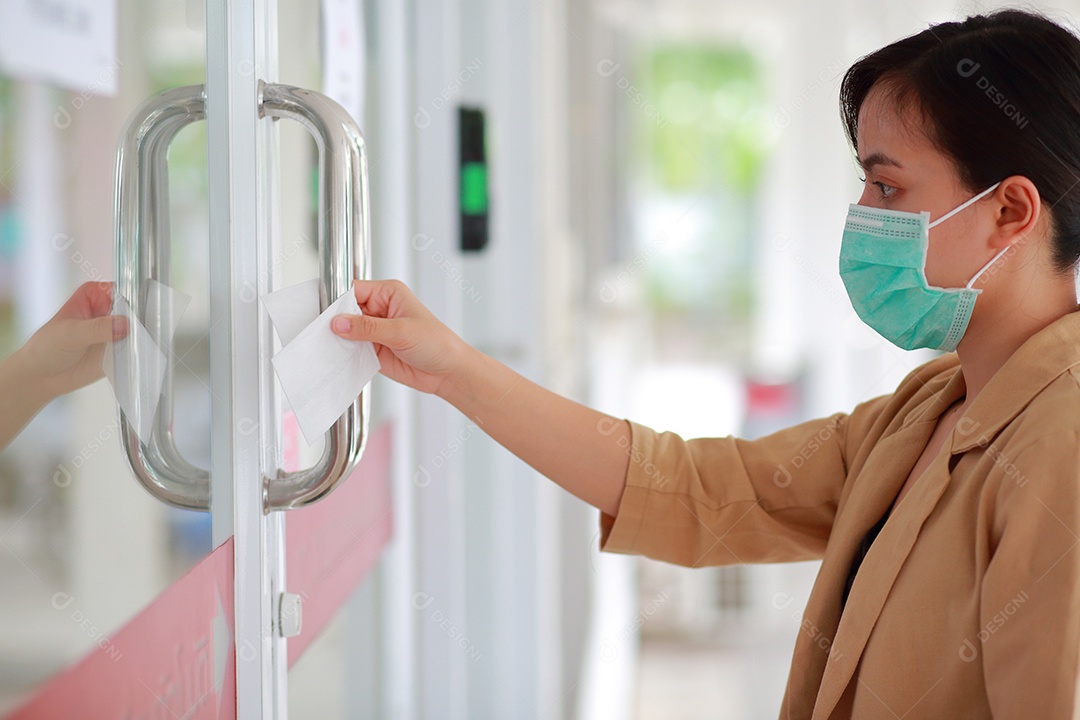 Opening the door with alcohol antibacterial tissue paper concept