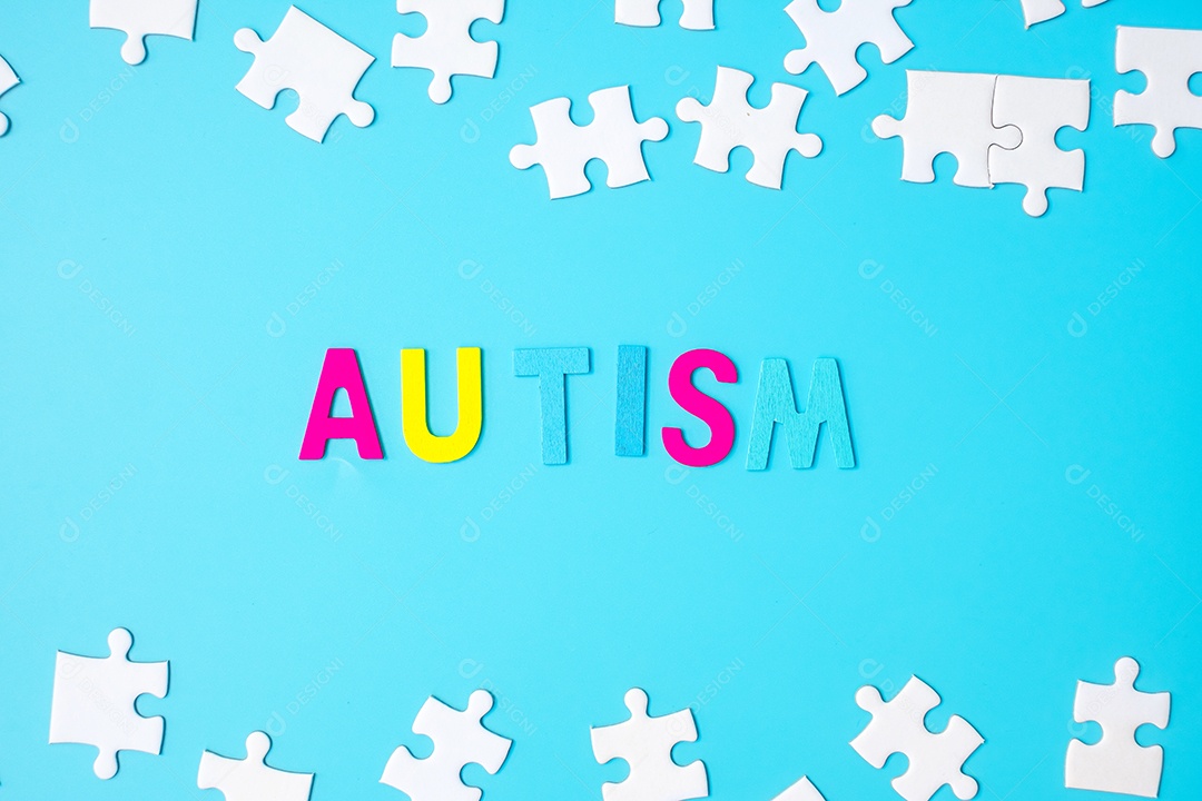 Texto de autismo com peças de quebra-cabeça brancas sobre fundo azul.