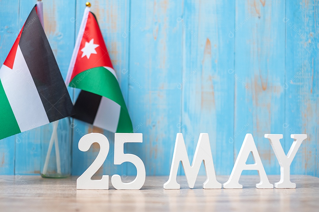 May 25 wooden text with flags of Jordan. Jordan Independence.