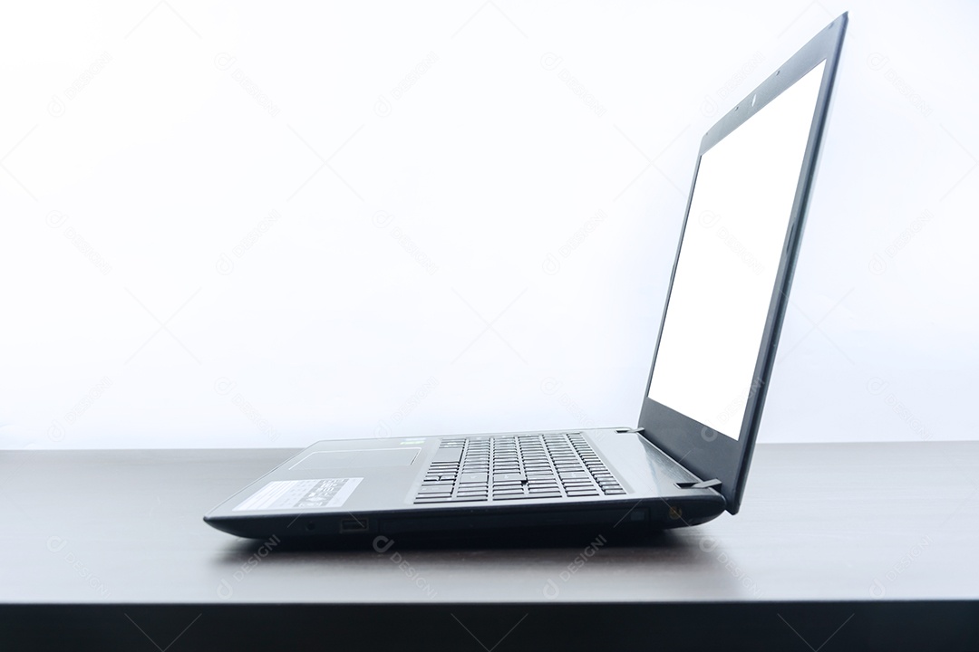 Blank screen of computer notebook on wooden table