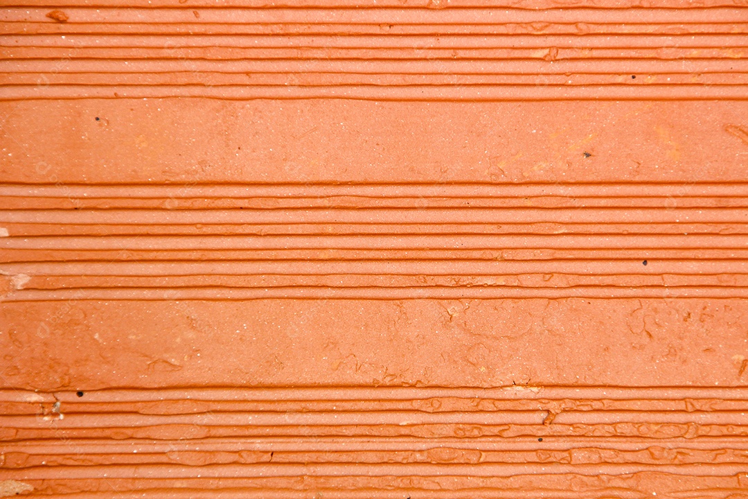 Textura de tijolo vermelho, muito utilizada em obras no Brasil.