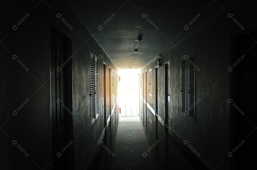 The light from the window of an old hotel corridor.