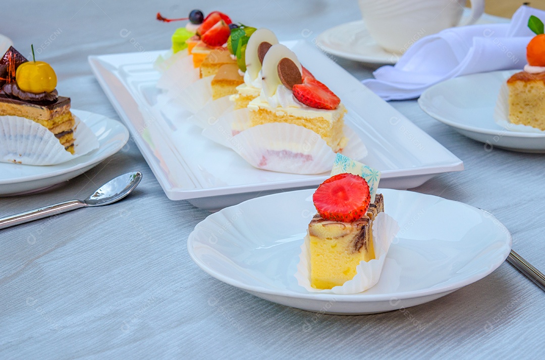 Delicious cake on plate on table.