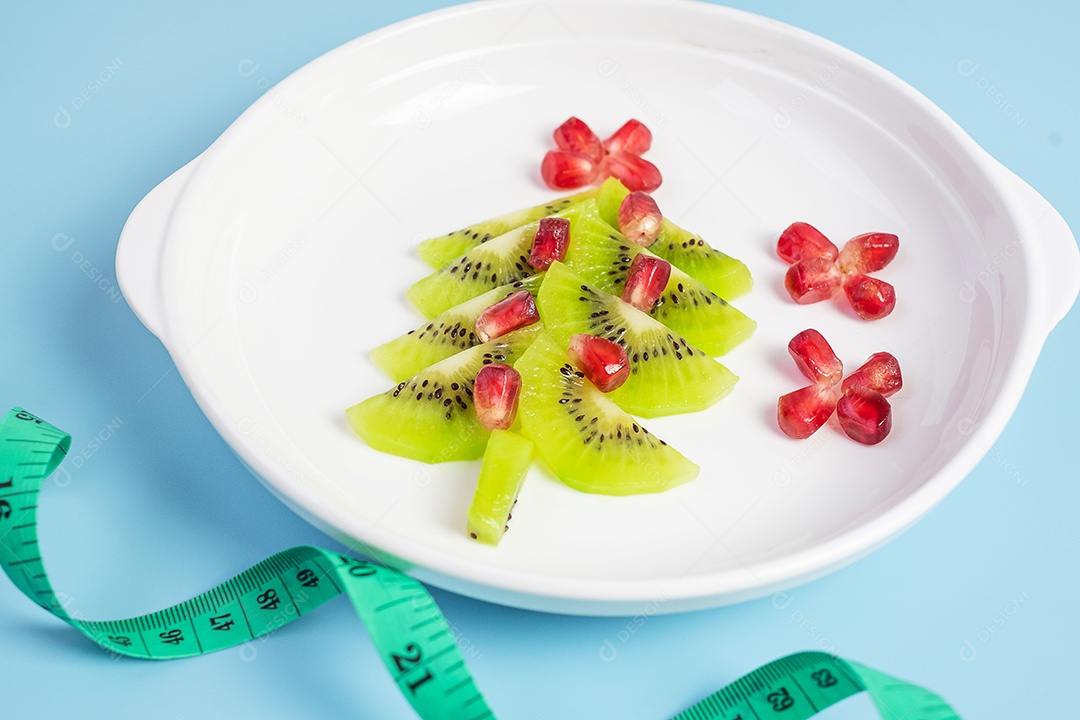 Árvore de Natal de frutas; Semente de kiwi e romã com garfo