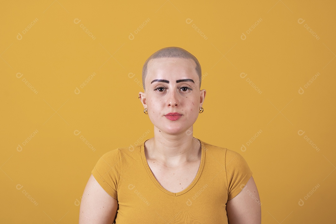 Beautiful bald young woman in pink october concept