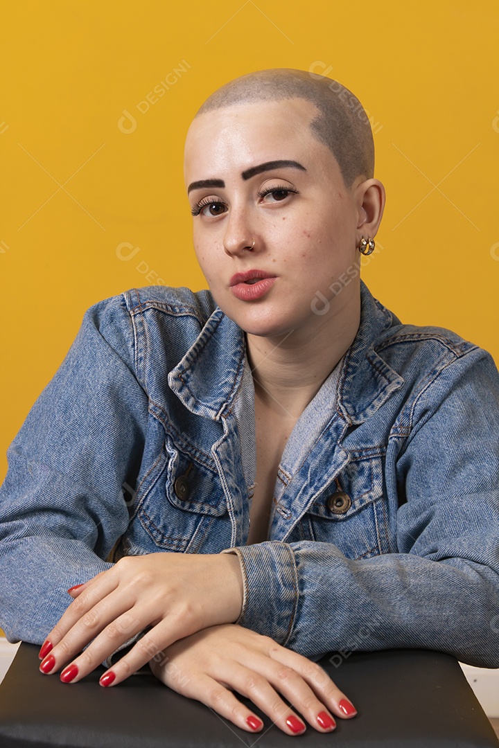 Beautiful bald young woman in pink october concept