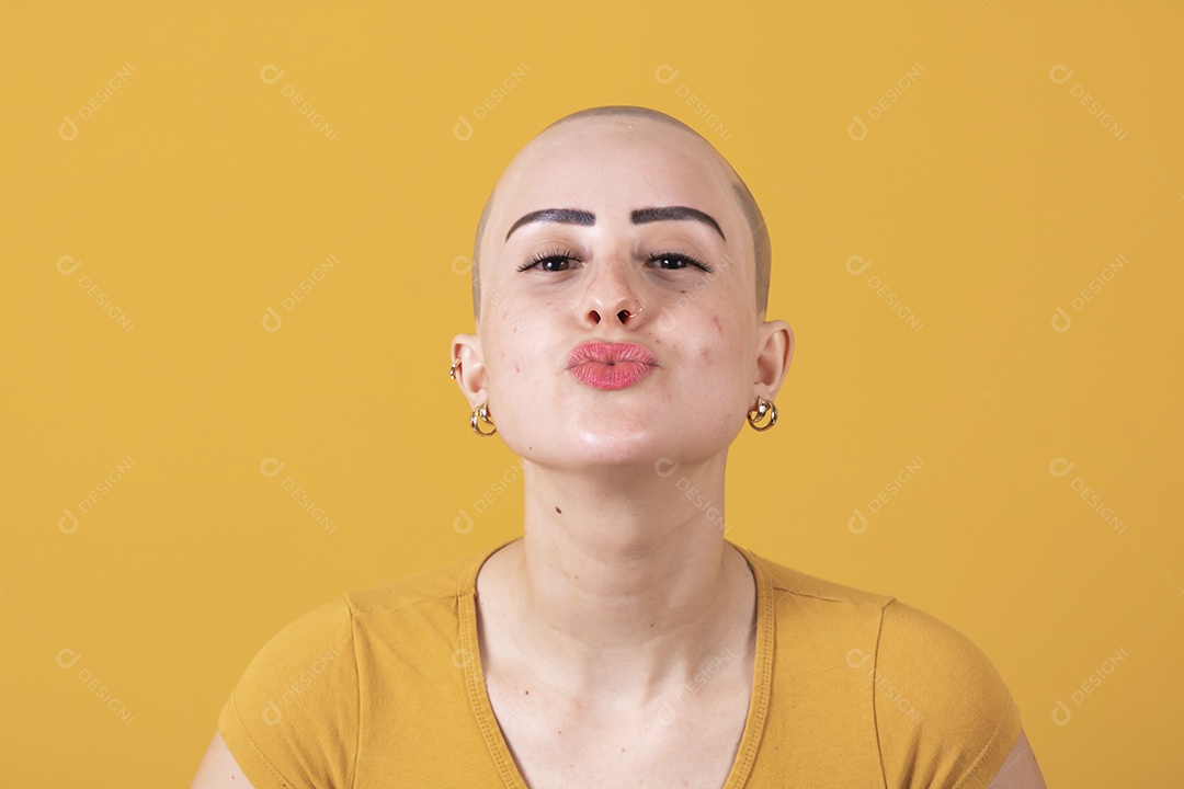 Beautiful bald young woman in pink october concept