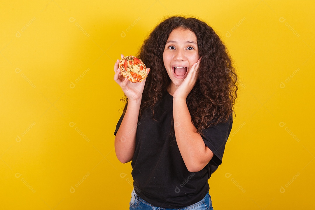 Beautiful woman young girl holding mini pizza over isolated yellow background