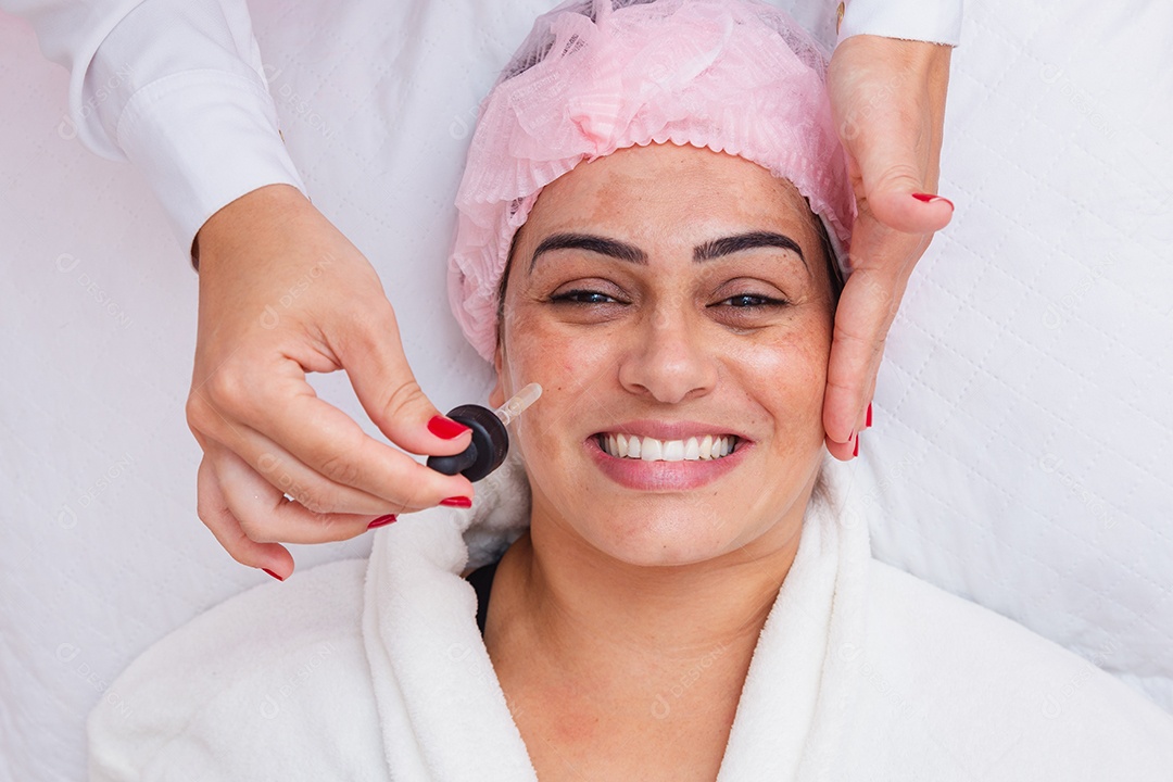 Facial massage on patient's skin, using tool called jade stone, skin care