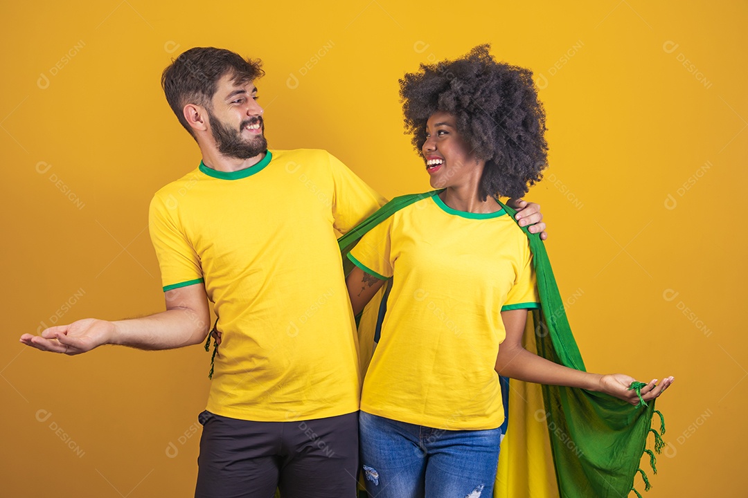 Brazilian couple holding the flag of Brazil