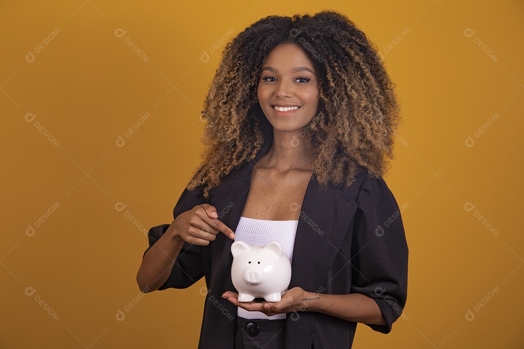 Beautiful young brunette afro hair woman on yellow isolated background