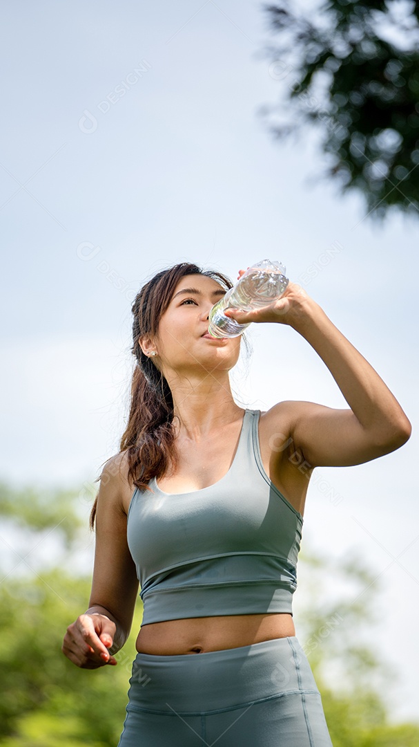 Fitness woman drinking water, Thirsty young woman drinking water.
