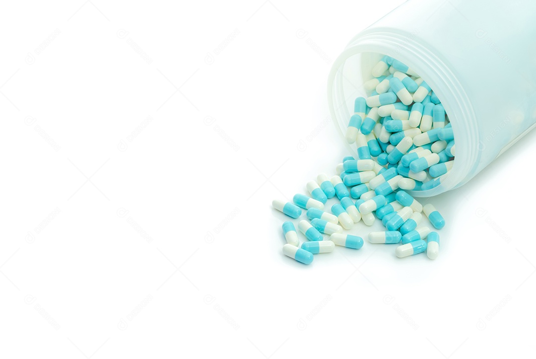 Comprimido de cápsula de antibiótico azul-branco e frasco de comprimidos de cápsula.