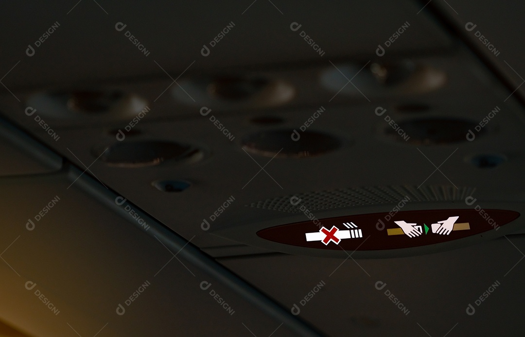 Aperte o sinal de cinto de segurança e o sinal de área proibida para fumantes