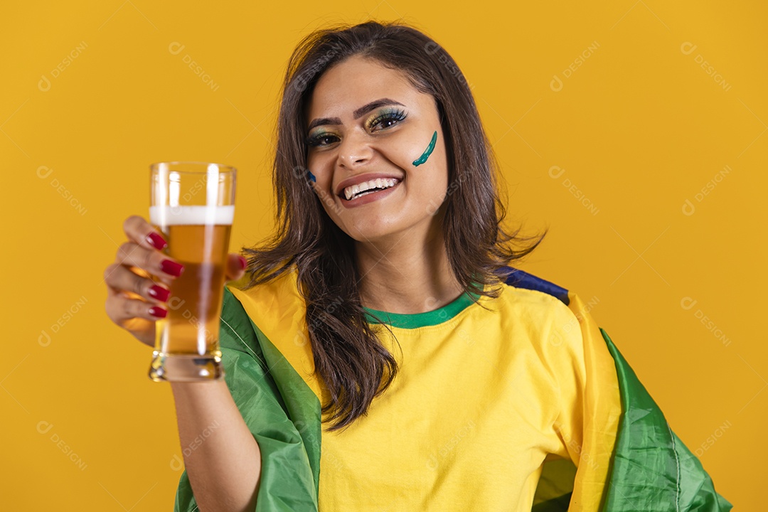 Beautiful young Brazilian woman holding glass of beer