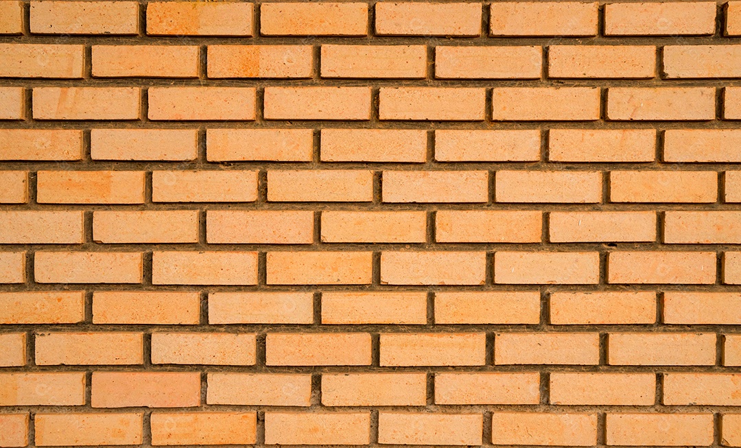 Fundo de textura de parede de tijolos laranja com espaço para texto
