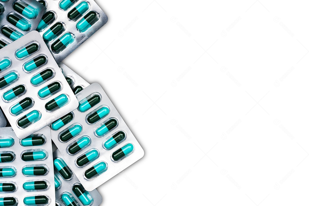 Vista superior de comprimidos de cápsulas de antibióticos azuis e verdes em blister