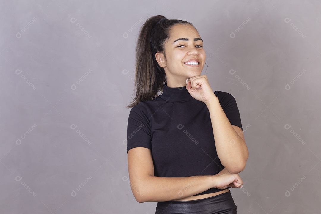 Smiling young woman with tied hair