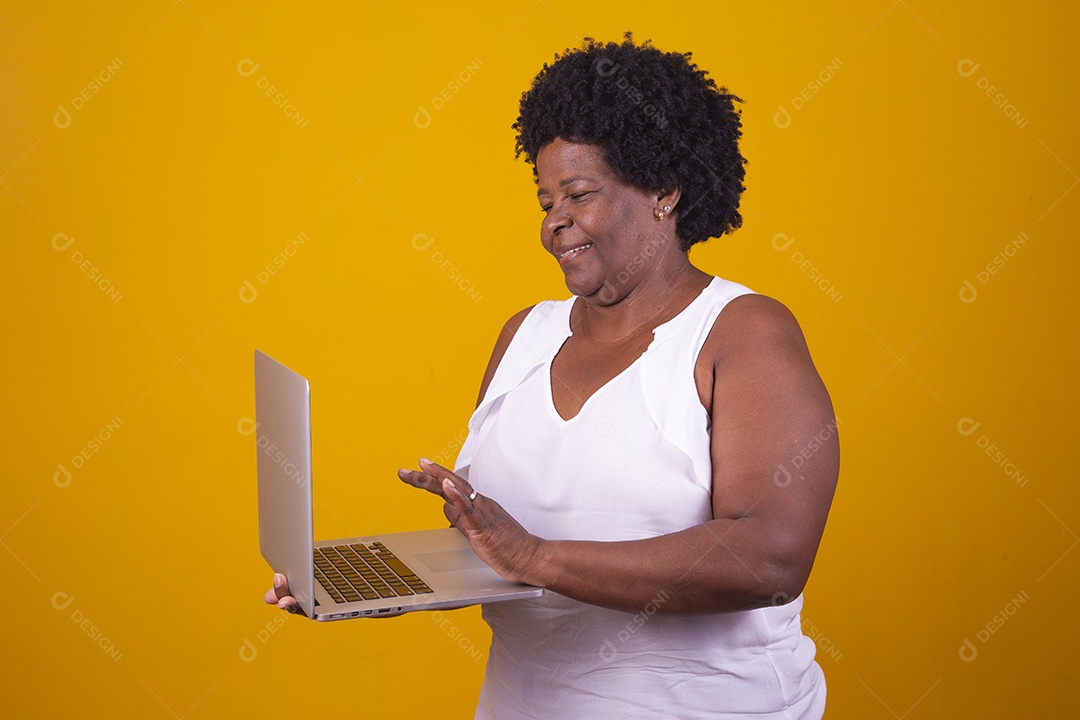 Middle-aged woman wearing a white blouse holding a notebook