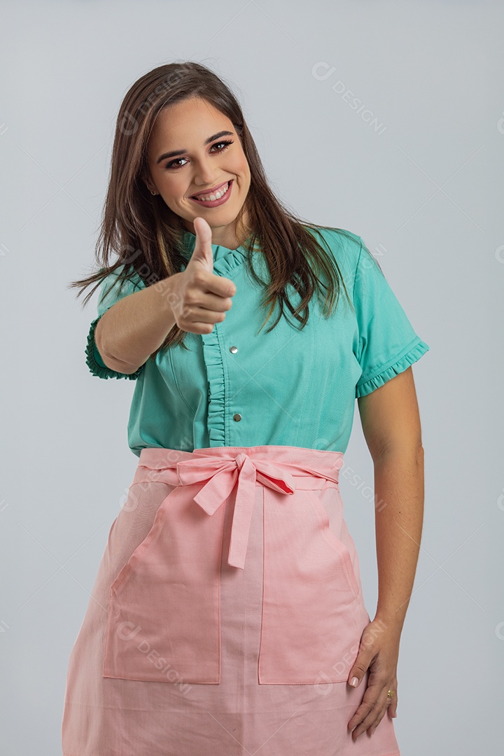 Beautiful young woman chef preparing cake