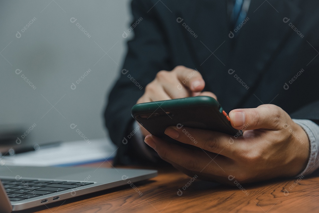 Businessman using smartphone marketing laptop computer business network manager.