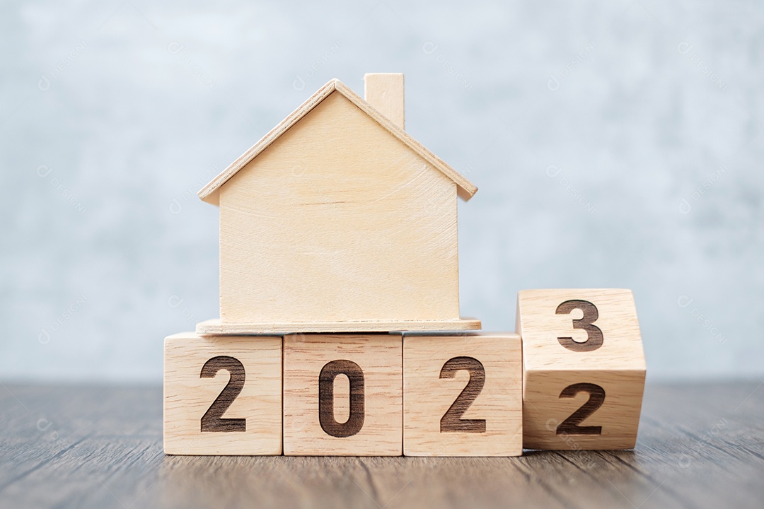 flip 2022 a 2023 bloco com modelo de casa. imobiliário, empréstimo à habitação, fiscal, investimento, financeiro, poupança e conceitos de resolução de ano novo