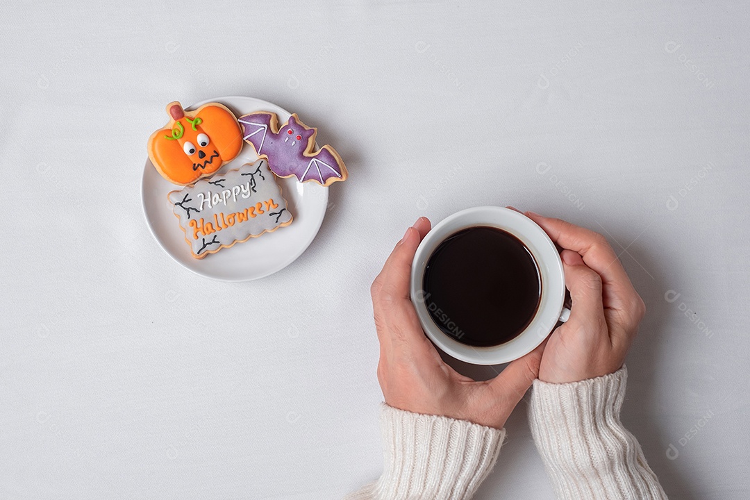 Woman holding coffee cup during Halloween funny cook meal