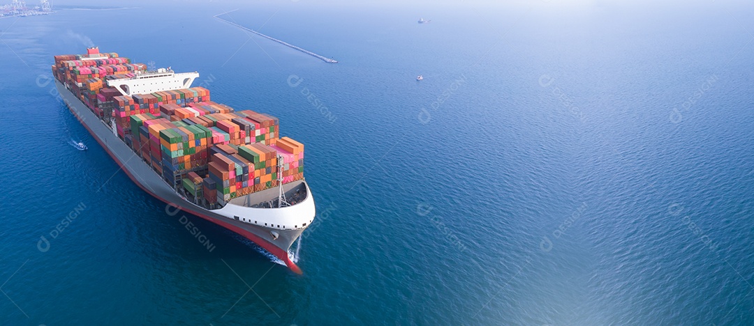 Cargo container ship running near import and export port international cargo terminal, logistic service and transportation concept.