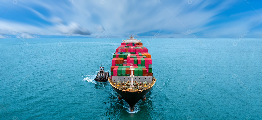 Aerial front view of cargo ship with contrail on ocean sea ship carrying container and running to export from international container port for ocean concept custom shipping cargo by ship service