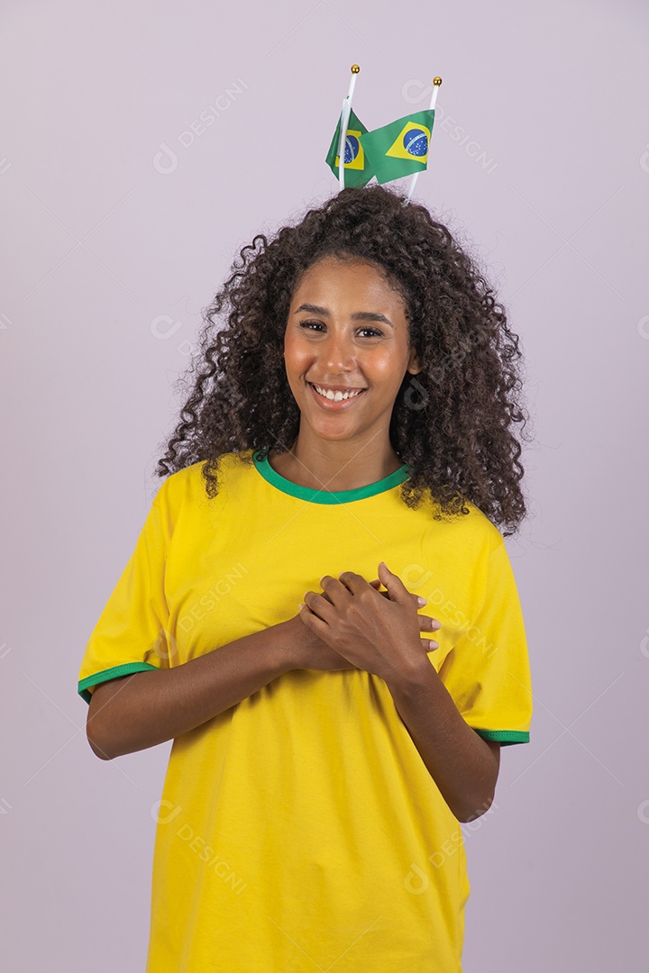 Beautiful young brunette woman supporting Brazil with afro hair wearing Brazil T-shirt over isolated background