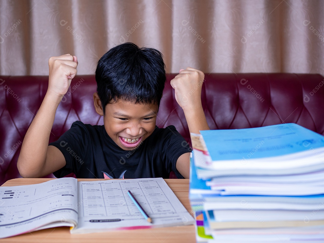 The boy was very happy to finish his homework.