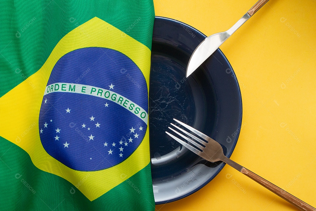 prato vazio com bandeira brasileira no topo - fome no Brasil