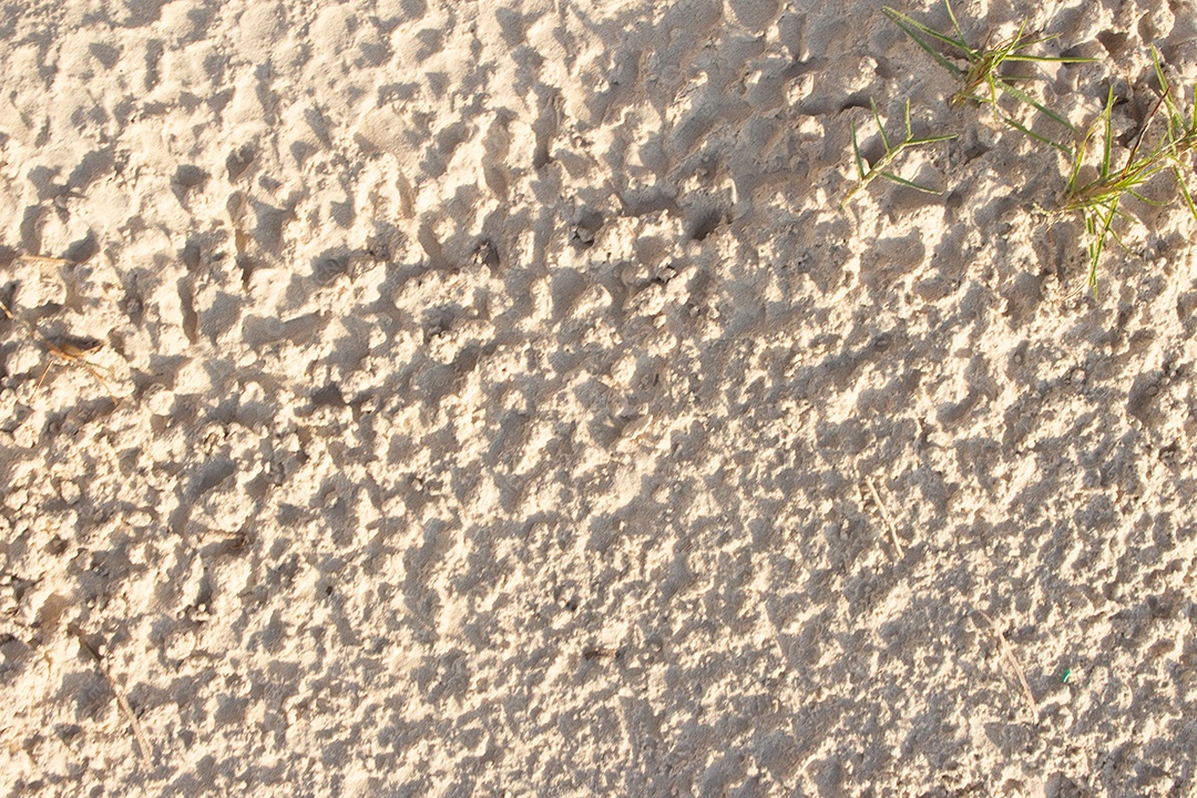 areia textura bege em um dia ensolarado - textura