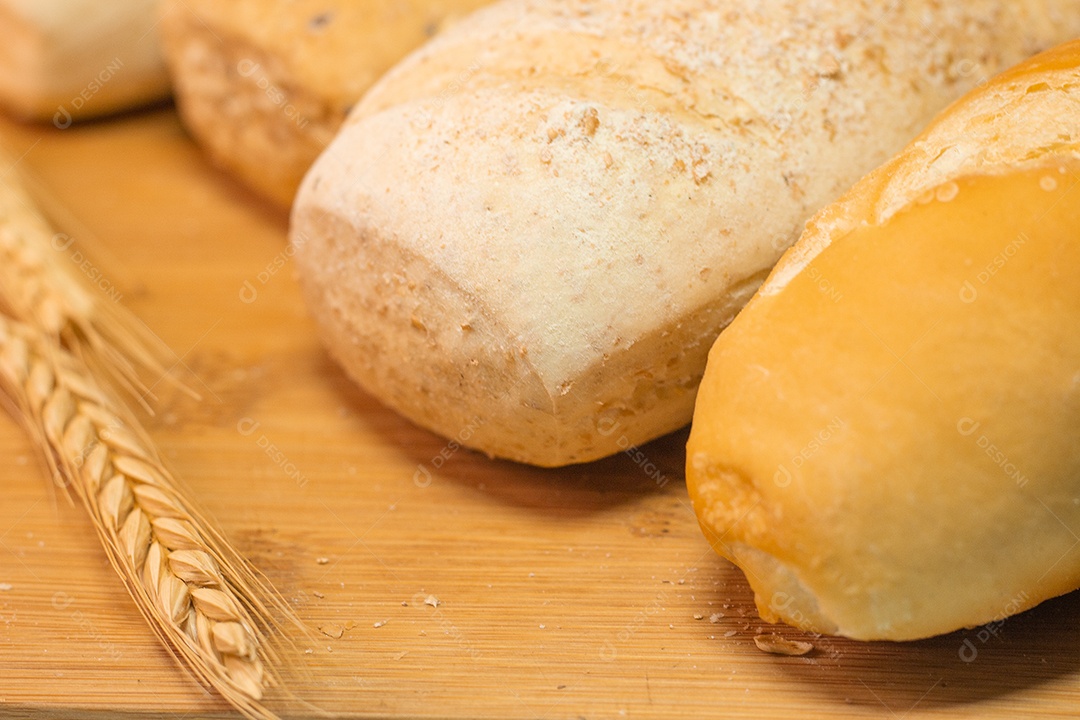 three types of bread on a wooden table