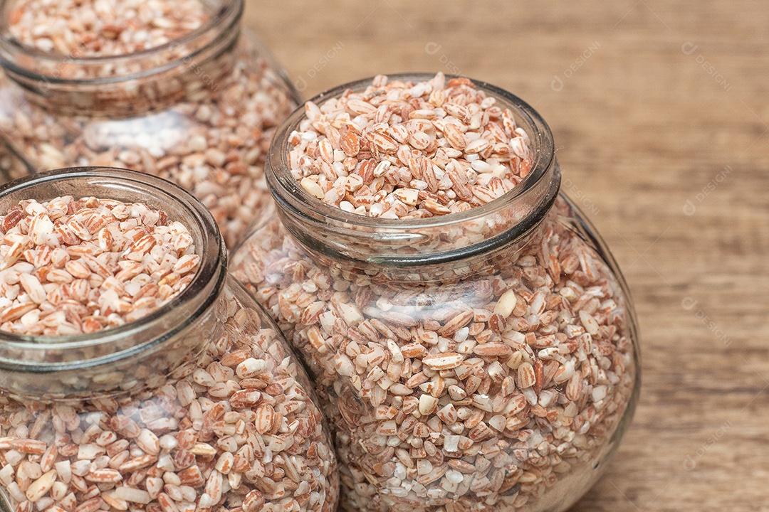 several bowls filled with raw organic rice