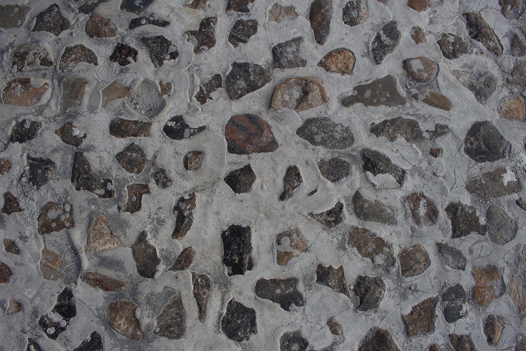 textura cinza de pequenas pedras cercadas por cimento branco