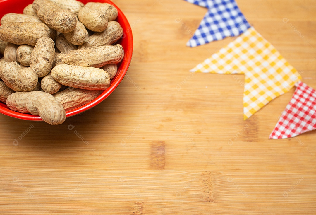 Bowl full of eaten peanuts on a wooden table Festa Junina