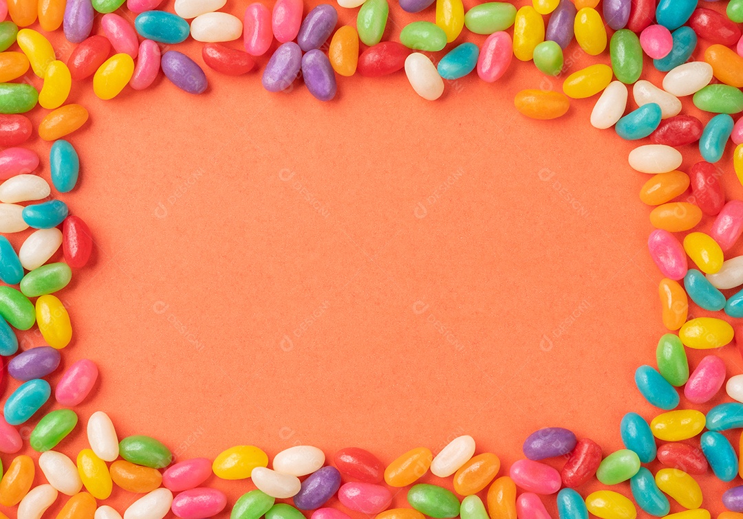 Quadro de doces coloridos sobre fundo laranja