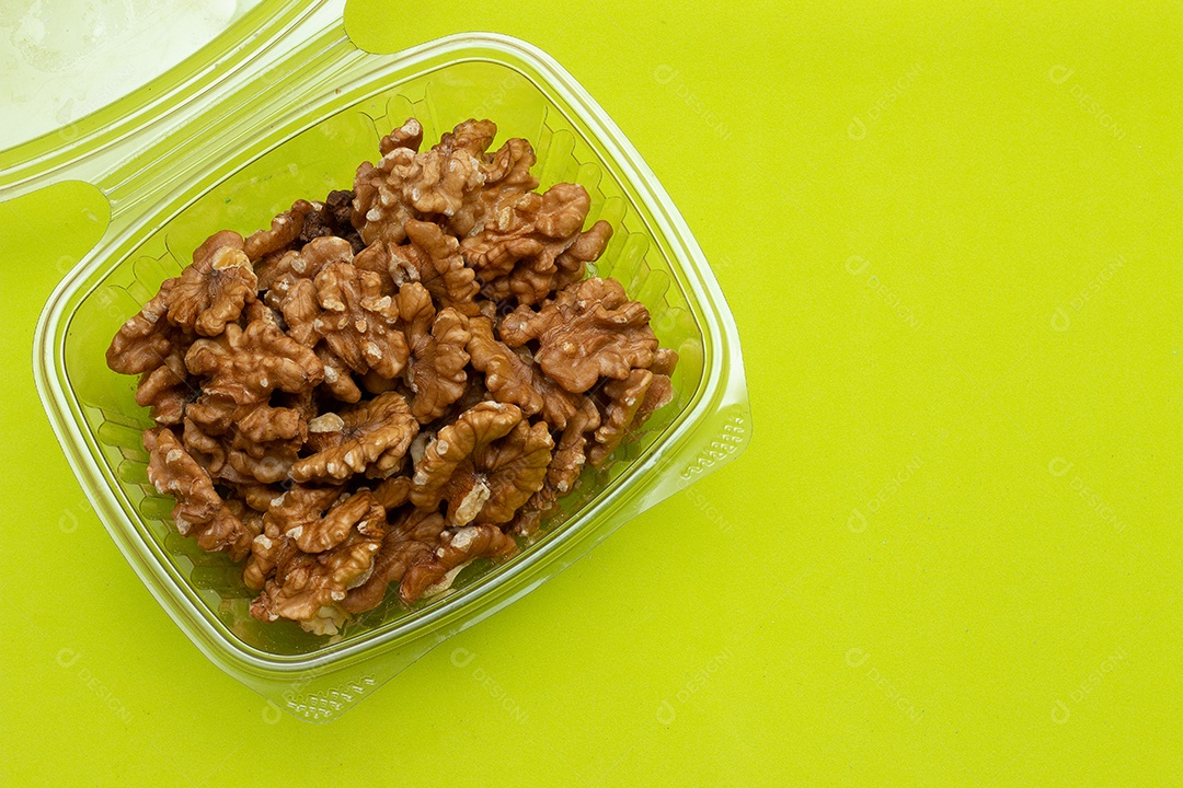 bowl full of almonds on a colored background