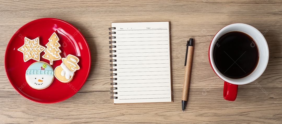 Blank notebook, black coffee cup, Christmas cookies and pen