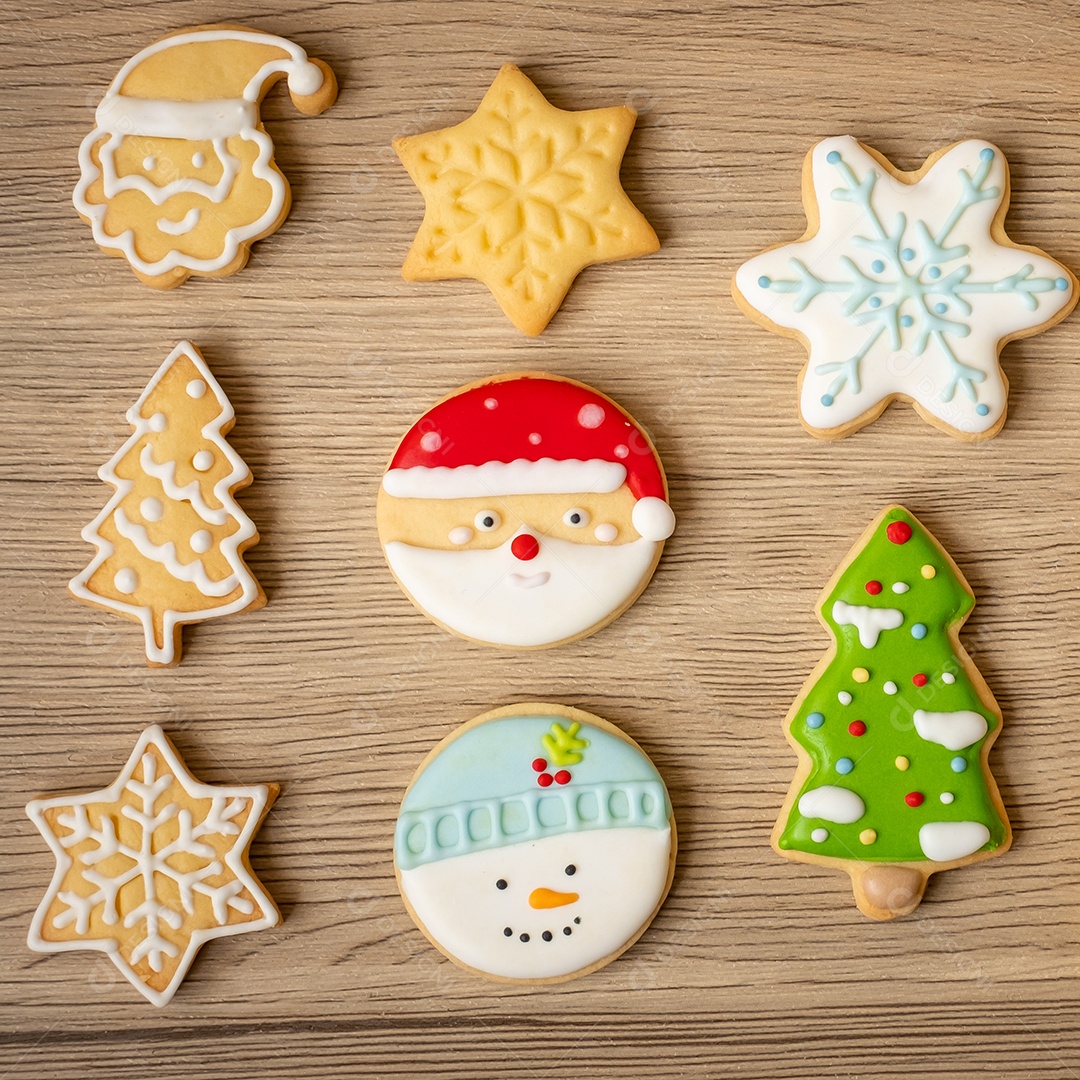 Merry Christmas with homemade cookies on wooden table background.